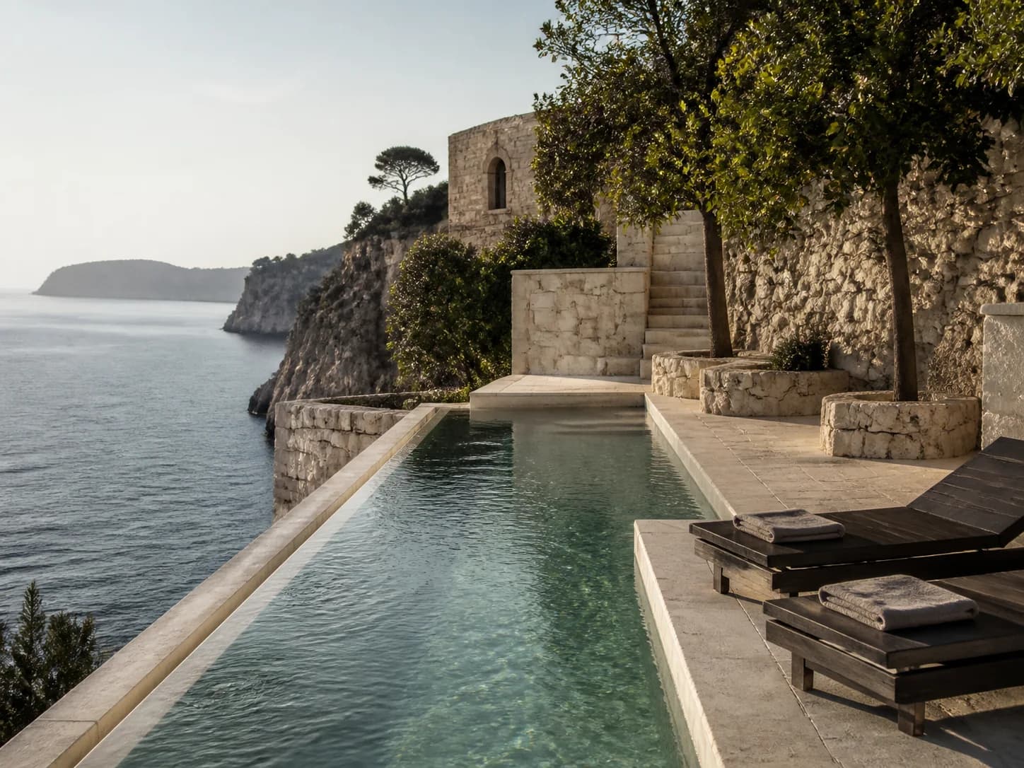 The cliff-edge swimming pool at Montreval Calanera in late afternoon.