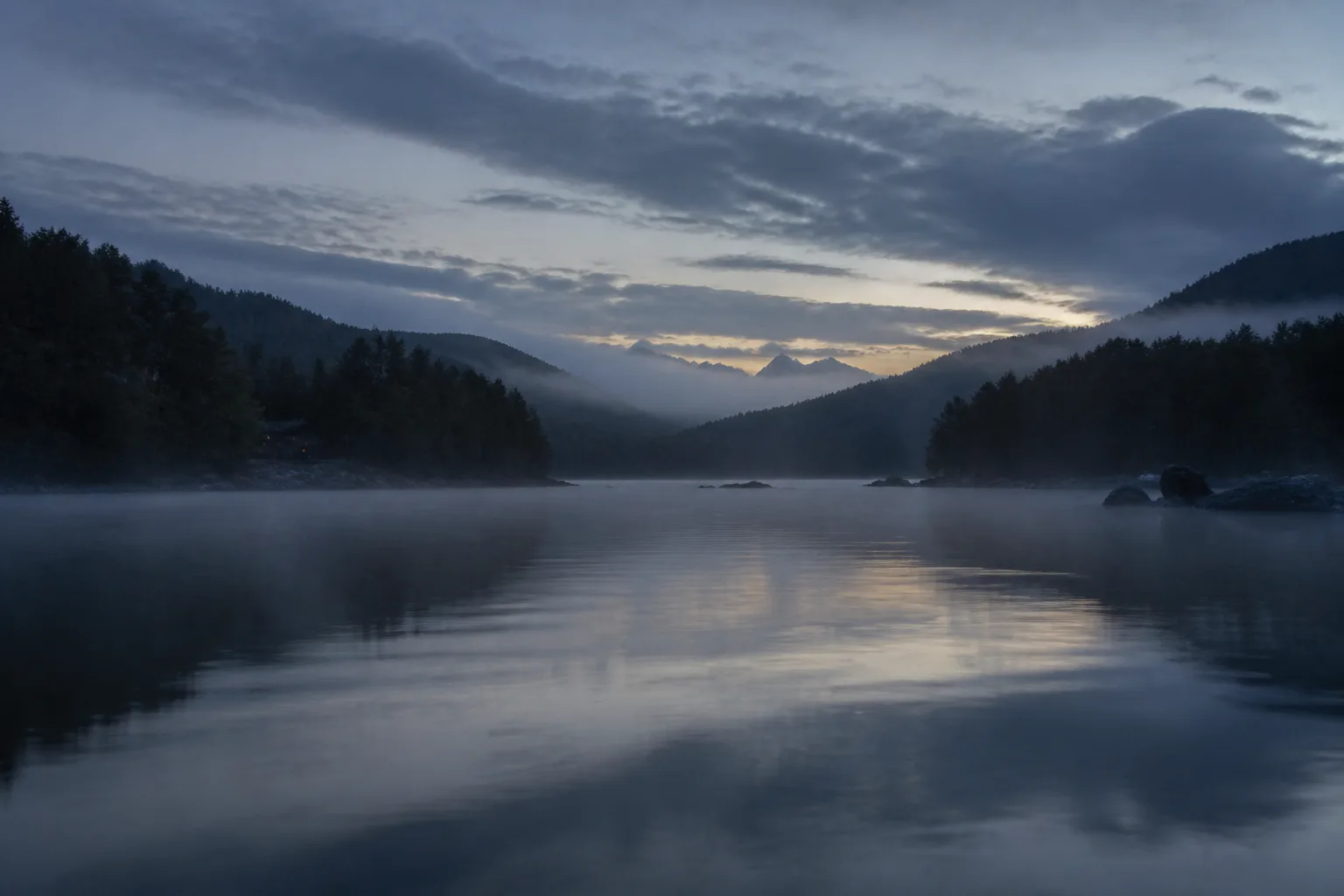 Lake Verane before sunrise, the far shore still in shadow.