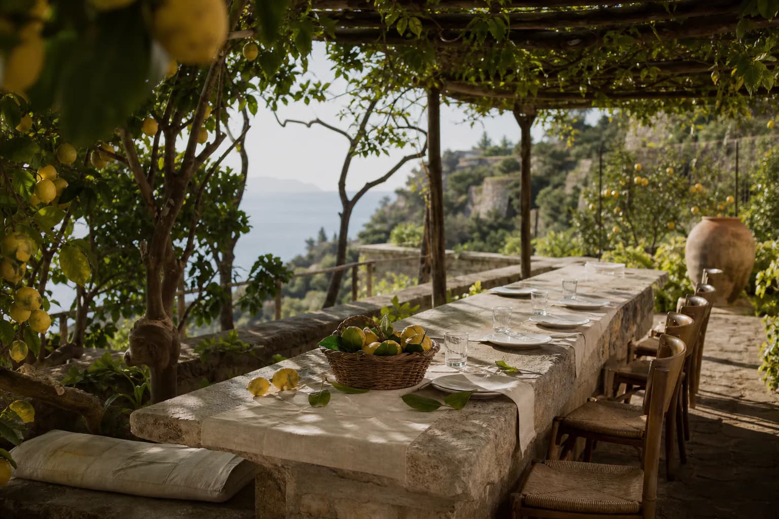 The open-sided Limonaia breakfast room among lemon trees at Montreval Calanera.