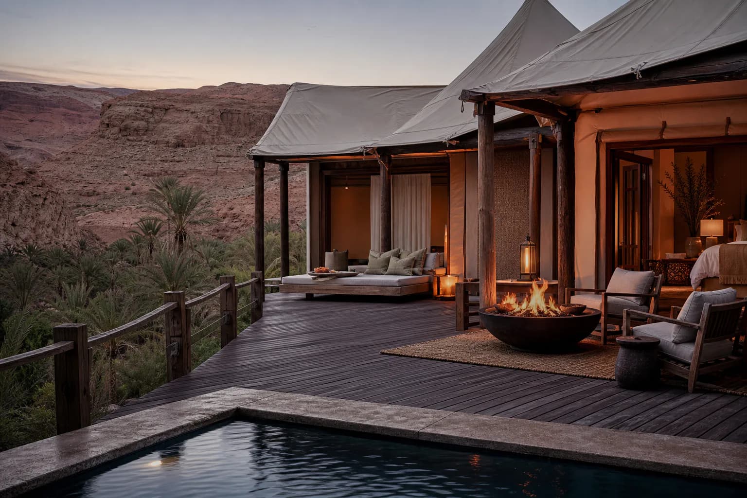 An Oasis Suite Tent at Montreval Sabaia with its fire bowl lit above the palm gardens.